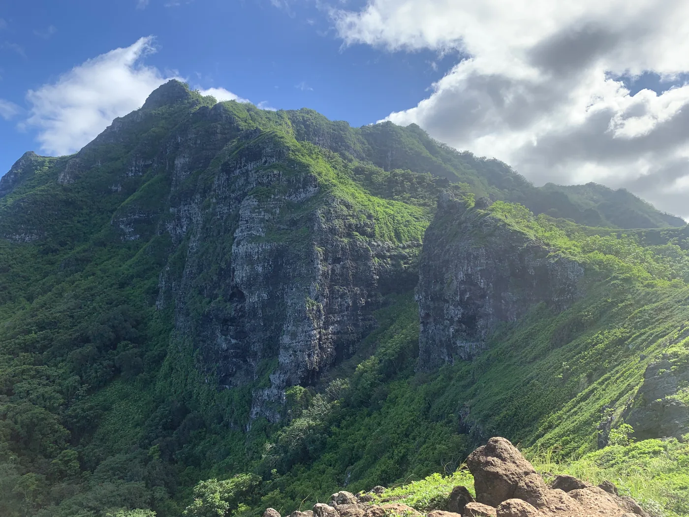 Steep green ridgeline with dramatic mountain textures