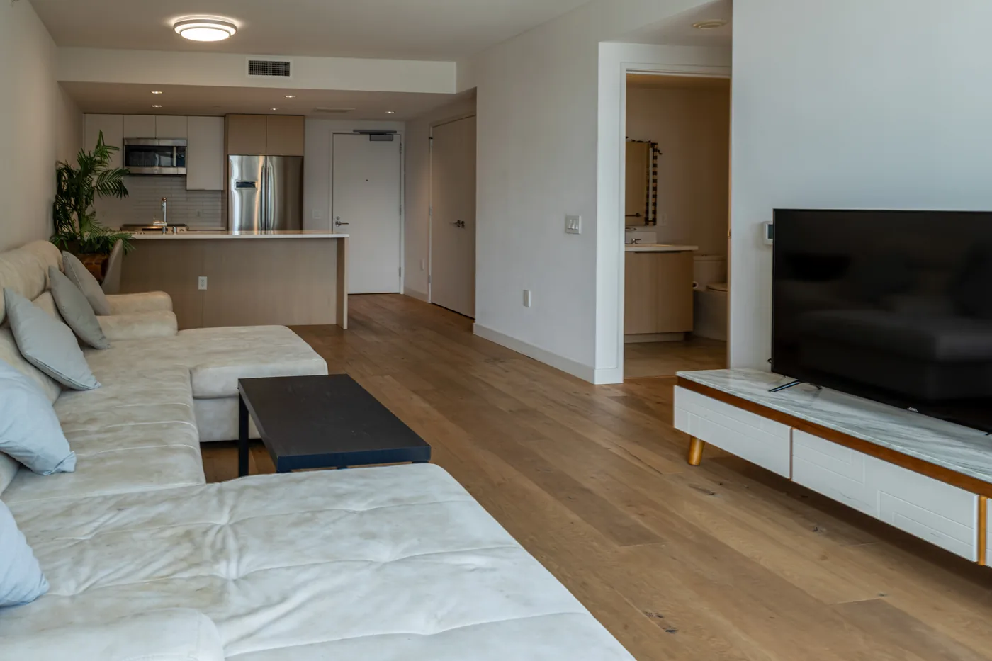 Open living area with media wall and city light